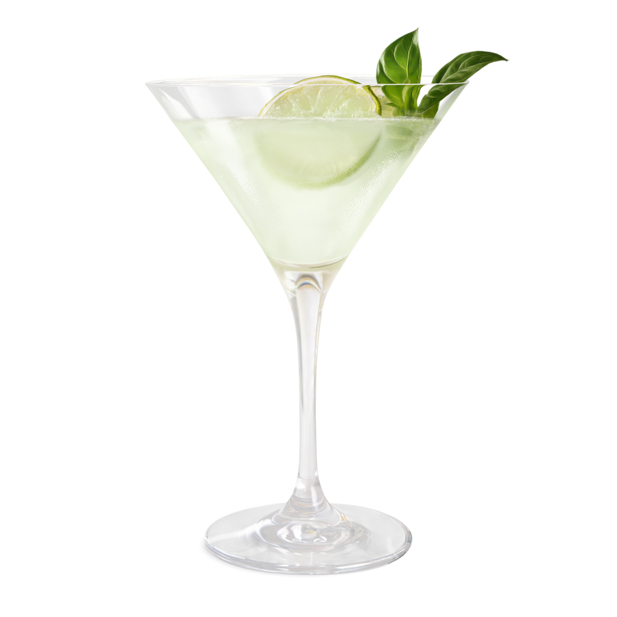 Cocktail in a martini glass with lime and basil